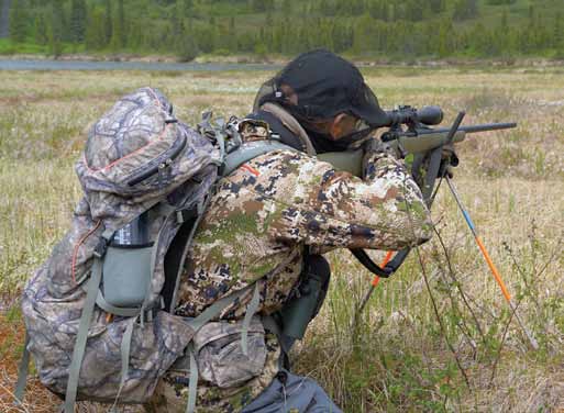 Spomer knelt in the bog and used his portable shooting sticks to steady his 189-yard shot. He’s still wearing the pack and mosquito headnet he had on when the bear appeared.